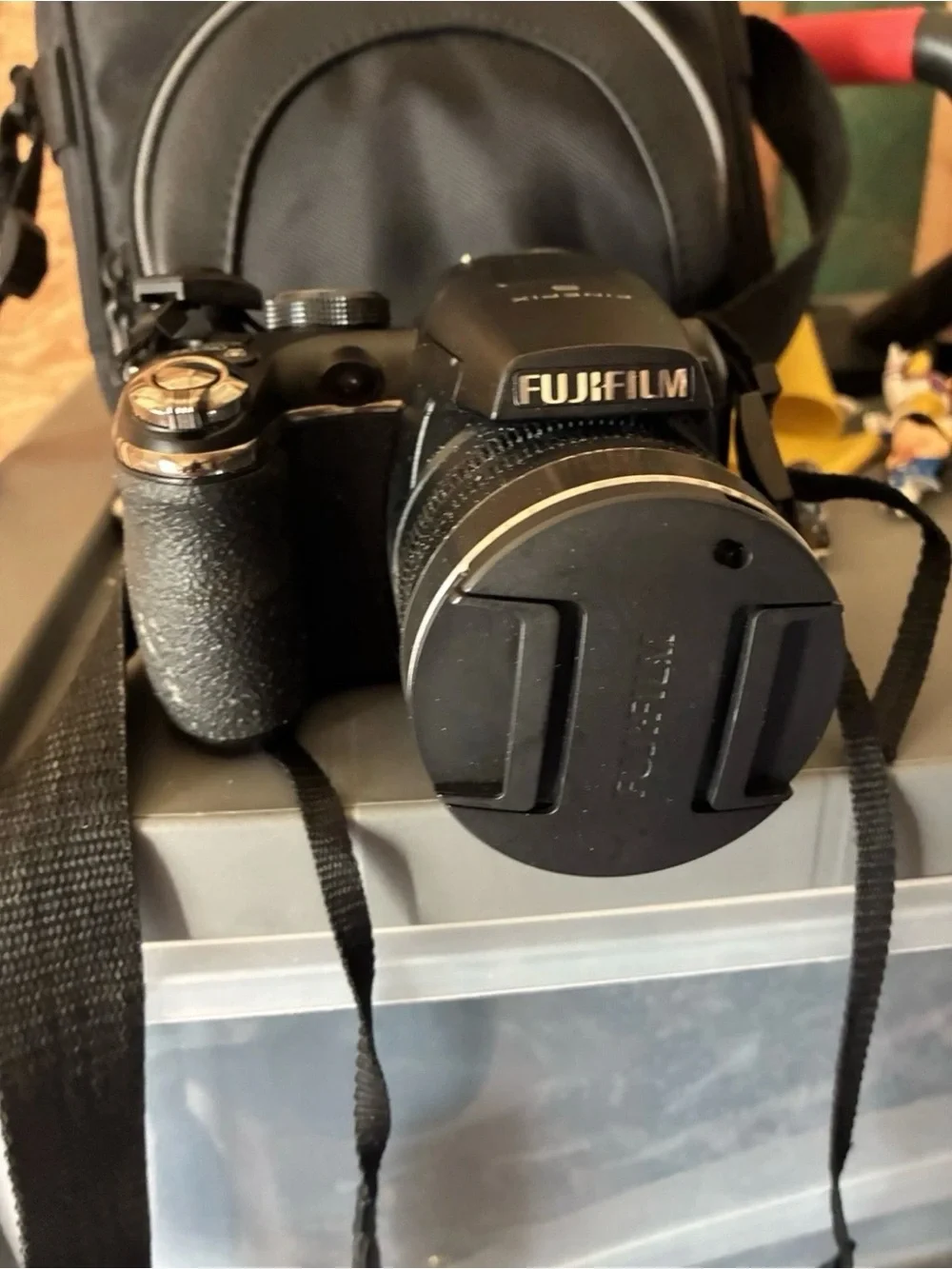 Fujifilm FinePix S-series digital camera with travel case